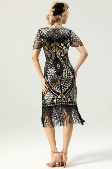 Vestido preto e dourado de 1920 com mangas de batwing